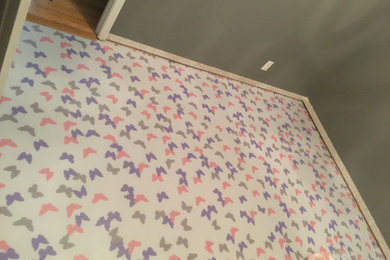 Example of a vinyl floor bedroom design in Austin