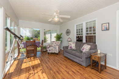 Inspiration for a huge timeless medium tone wood floor and multicolored floor sunroom remodel in Richmond with a standard ceiling
