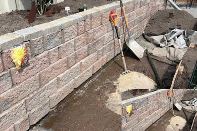 Design ideas for a contemporary stone fence landscaping in Other.