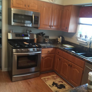 cabinet refacing with glass tile backsplash