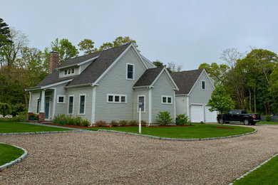 Mid-sized arts and crafts gray two-story wood exterior home photo in Boston with a shingle roof