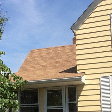 After Reconstruct porch roof adding a 2 foot overhang to protect steps and windo