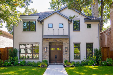 Inspiration for a large transitional gray three-story stucco house exterior remodel in Dallas with a hip roof and a shingle roof