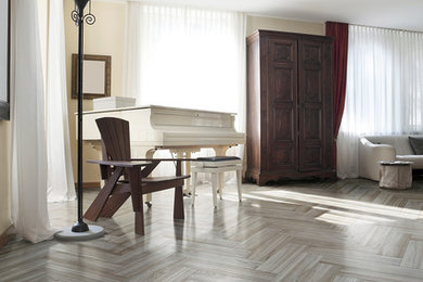 Living room - mid-sized contemporary open concept light wood floor living room idea in Boise with beige walls