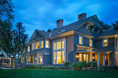 Inspiration for a large timeless gray three-story wood gable roof remodel in Burlington