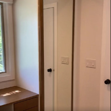 Modern Master Closet with Lighting and Drawers