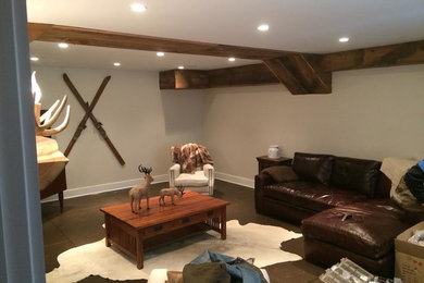 Basement - large rustic basement idea in New York with beige walls and a standard fireplace