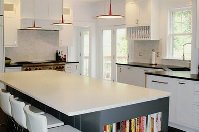 Enclosed kitchen - large transitional dark wood floor and brown floor enclosed kitchen idea in Boston with a single-bowl sink, shaker cabinets, white cabinets, soapstone countertops, gray backsplash, marble backsplash, stainless steel appliances and an island