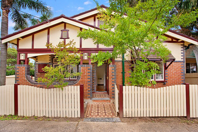Mid-sized traditional one-storey brick exterior in Sydney.