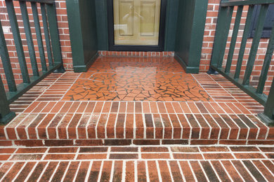 Brick front porch photo in Other