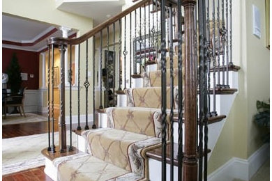 Example of a mid-sized classic wooden l-shaped metal railing staircase design in Philadelphia with painted risers