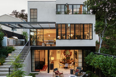 Trendy white three-story exterior home photo in San Francisco