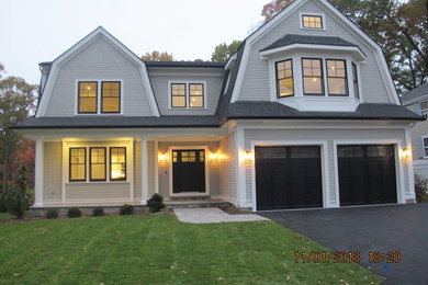 Example of a transitional home design design in Boston