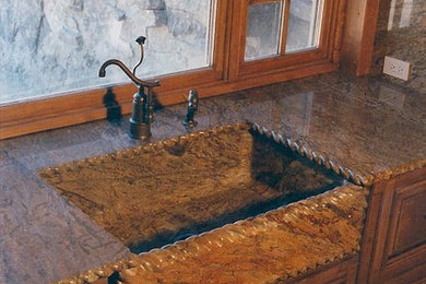 Kitchen - kitchen idea in Other with an integrated sink and granite countertops