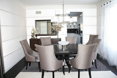 Inspiration for a mid-sized modern dark wood floor and black floor enclosed dining room remodel in Chicago with white walls and no fireplace
