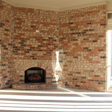 Fireplace with Media Outlets at Screened Back Porch