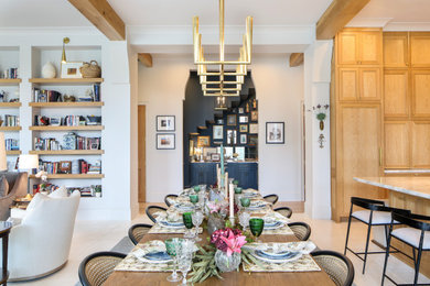 Dining room - large coastal dining room idea in New Orleans with white walls