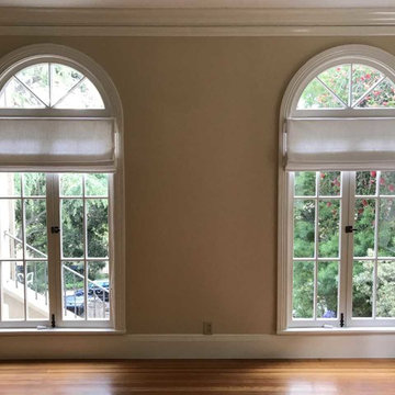 Roman shades mounted below arch