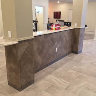 Design ideas for an expansive traditional walk-out basement in Chicago with beige walls, porcelain flooring, no fireplace and grey floors.