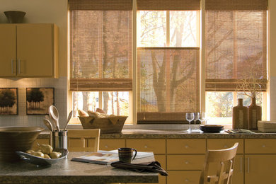 Mid-sized trendy l-shaped eat-in kitchen photo in Vancouver with flat-panel cabinets, light wood cabinets, granite countertops, beige backsplash, ceramic backsplash, stainless steel appliances and an island