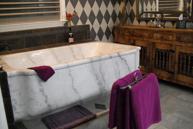 Example of a mid-sized classic master gray tile and stone tile slate floor bathroom design in Los Angeles with a vessel sink, furniture-like cabinets, distressed cabinets, marble countertops, a one-piece toilet and multicolored walls