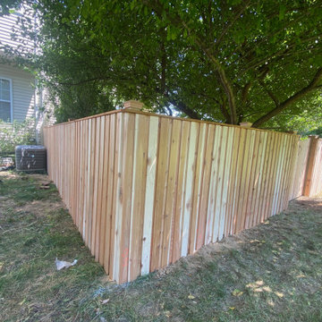 Cedar board and batten fence