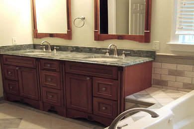 Design ideas for a large transitional master bathroom in Chicago with beaded inset cabinets, medium wood cabinets, a drop-in tub, multi-coloured tile, subway tile, yellow walls, ceramic floors and an undermount sink.
