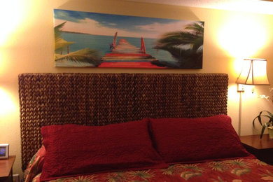 Large beach style master carpeted bedroom photo in Other with yellow walls
