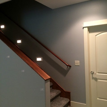 Urbandale basement with built in cabinets.