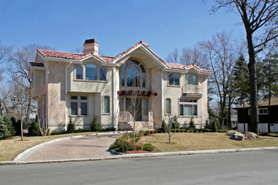 Example of a tuscan exterior home design in New York