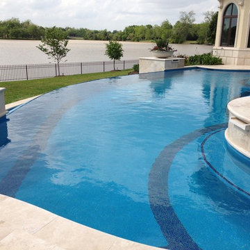 Traditional curved pool with custom mosaic design