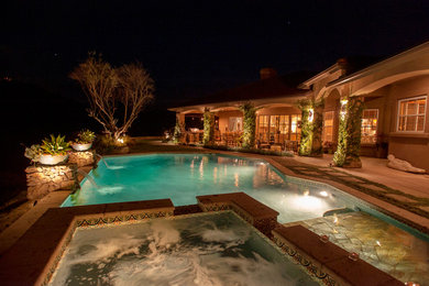 Hot tub - large mediterranean backyard tile and rectangular natural hot tub idea in San Diego