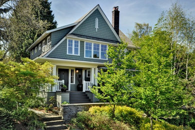 Example of a classic blue exterior home design in Seattle