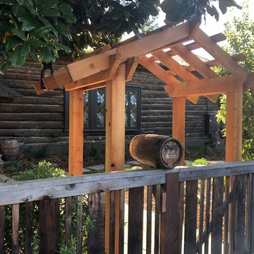 Barrel-shaped (hobbit-style) mailbox with artistic metal work