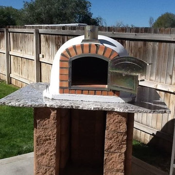 Brick pizza oven on natural stone stand