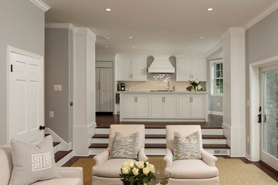 Inspiration for a contemporary dark wood floor family room remodel in DC Metro with gray walls, a standard fireplace and a wall-mounted tv