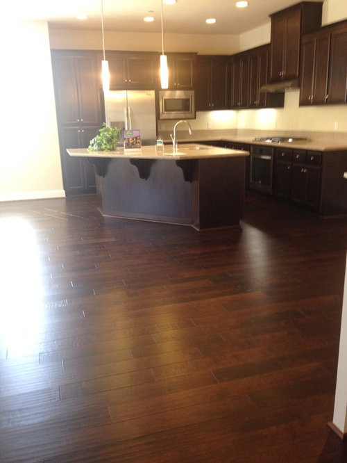 Dark wood floor with dark cabinets