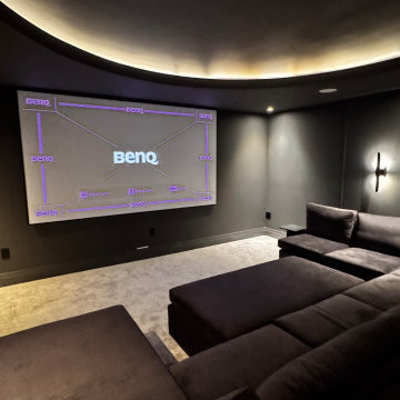 The Midnight Dome - Modern Black Home Theater with Coved Ceiling & Pit Sectional