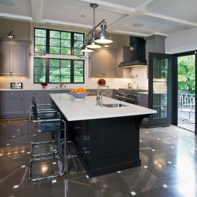Example of a large classic u-shaped ceramic tile, multicolored floor and coffered ceiling eat-in kitchen design in New York with an undermount sink, recessed-panel cabinets, gray cabinets, quartz countertops, white backsplash, ceramic backsplash, stainless steel appliances, an island and white countertops