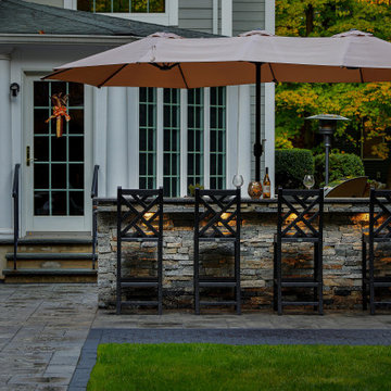 Make a Statement with a Versatile Outdoor Kitchen and Double Fire Feature