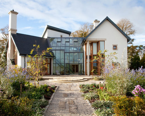 Best Modern Country Design Ideas & Remodel Pictures | Houzz Inspiration for a country two-storey white exterior in Hampshire with a  gable roof.