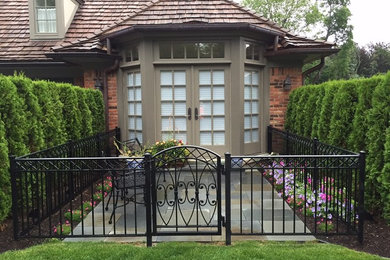 Mid-sized arts and crafts gray two-story mixed siding exterior home photo in Detroit with a shingle roof