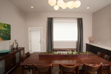 Enclosed dining room - mid-sized transitional dark wood floor enclosed dining room idea in Chicago with beige walls and no fireplace