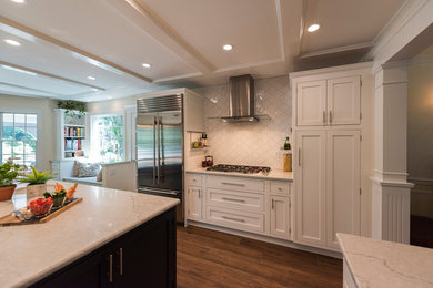 Photo of a transitional eat-in kitchen in New York with an undermount sink, shaker cabinets, white cabinets, quartz benchtops, white splashback, ceramic splashback, ceramic floors, with island, brown floor and white benchtop.
