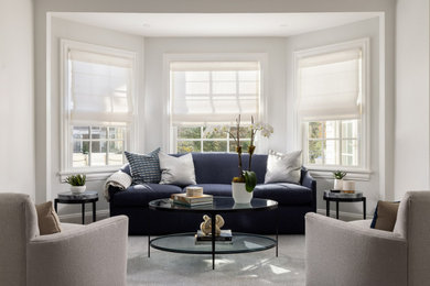 Example of a mid-sized transitional formal and open concept medium tone wood floor living room design in New York with white walls, no fireplace and no tv