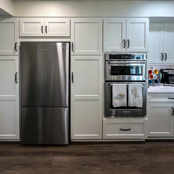 Custom Two-Toned Green and White Kitchen with Laventa Carrara Quartz Countertops