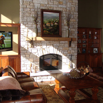 Swivel Mount Television in Cabinet Next to Stone Fireplace