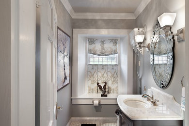 Example of a large classic black and white tile marble floor and multicolored floor powder room design in DC Metro with furniture-like cabinets, dark wood cabinets, gray walls, an undermount sink, marble countertops and white countertops