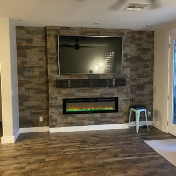 Kenai Stacked Stone Electric Fireplace and TV Accent Wall