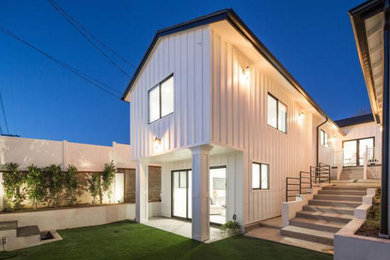 Mid-sized country white two-story concrete fiberboard house exterior idea in Los Angeles